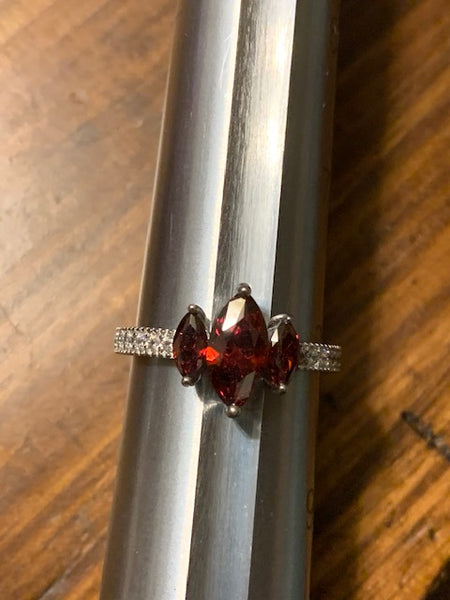 Silver-toned Costume Ring with Three Red Stones:  Three Grantings of Sanguine Power